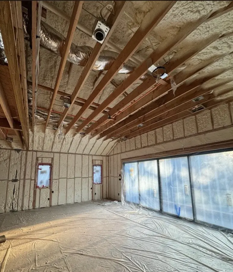 Interior walls and ceiling insulated with spray foam during new construction in Spring Hill